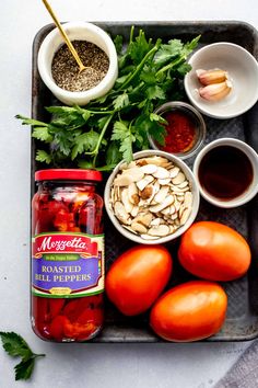 tomatoes, almonds, parsley and other ingredients on a tray