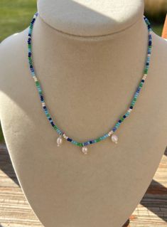 Beautiful hues of blue and green seed bead choker with freshwater pearl accents. 15 inches long please specify if needs to be longer. Diy Seed Bead Necklace, Seed Bead Choker, Green Beaded Necklace, Bead Choker, Crystal Lake, Jewelry Making Project, Seed Bead Necklace, Choker Necklaces, Beaded Choker