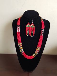 "Necklace comes with matching earrings. Dimensions: 27\" Main color: red Available in different colors.  More necklaces here; https://www.etsy.com/shop/PrimeBeadsKe?ref=seller-platform-mcnav&section_id=33399833 All items are shipped through dhl express!" Traditional Red Beaded Earrings With Colorful Beads, Red Polished Beads Jewelry Sets, Red Jewelry Sets With Polished Round Beads, Traditional Red Beaded Earrings With Large Beads, Traditional Red Beaded Necklaces With Dangling Beads, Traditional Red Beaded Necklace With Dangling Beads, Traditional Red Jewelry Sets With Colorful Beads, Red Beaded Bohemian Jewelry Sets, Red Bohemian Beaded Jewelry Sets