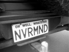 a black and white photo of a sign that says, oh well, whatever nvrmnd