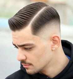 Textured Hard Side Part with Low Fade. This stylish haircut for men is timeless, versatile and effortlessly attractive, making it a popular style suitable for any occasion, from the office to formal occasions like weddings.