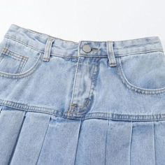 Elevate your style with our iconic 90s-inspired pleated miniature jean skirt from the 2023 Summer Collection. Perfect for sunny summer days and breezy summer nights. this mid-rise skirt features a light wash. a zipper & button closure. and pleats that will take your look to the next level.Why You'll Fall In LoveThis 90s-inspired mini skirt is the perfect blend of feminine charm and timeless style. With its mid-rise form and light wash. it's sure to add instant style to your wardrobe. The pleats. High-waisted Denim Pleated Skirt, High Waist Denim Pleated Skirt For Spring, Trendy Pleated Short Denim Skirt, Mini Denim Pleated Skirt, Trendy Medium Wash Mini Skirt For Summer, Pleated Denim Mini Skirt For Spring, Retro Mini Pleated Skirt For Spring, Spring Retro Mini Pleated Skirt, Spring Pleated Denim Mini Skirt