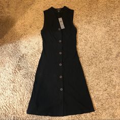 Ann Taylor Sleeveless Button Front Rib Knit Dress. Color: Black. New With Tags Black Sleeveless Midi Dress With Buttons, Affordable Knee-length Sleeveless Dress With Button Closure, Medium Wash Non-stretch Button-up Dress, Rib Knit Dress, Ann Taylor Dresses, Ribbed Knit Dress, Ann Taylor, Knit Dress, Rib Knit