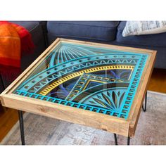 a coffee table with blue and yellow designs on it