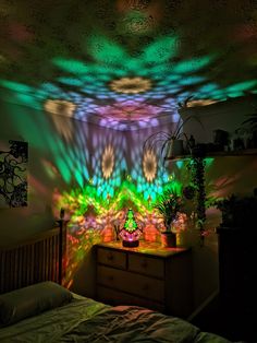 a bed room with a large amount of lights on the ceiling and plants in pots