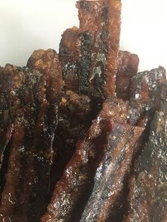 closeup of beef strips piled on top of each other with seasoning sprinkles