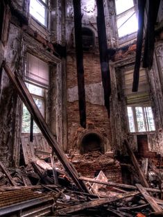 the interior of an abandoned building with broken windows