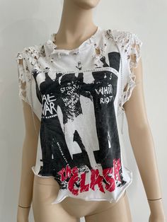 The clash punk t shirt, custom distressed, uniquely designed backside with  custom shoulder chains. Punk Distressed T-shirt For Festivals, Distressed Punk Style Tops For Festivals, White Distressed Tops For Concert, Edgy Distressed Tops For Festival, Punk Shirt Diy, Edgy Distressed Tops For Concert, Distressed Rocker Tops For Alternative Fashion, Rocker Distressed Tops For Streetwear, Distressed Rocker Tops For Streetwear