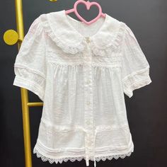 Size 			M 			L 		 		 			Bust 			96 			100 		 		 			Waist 			100 			104 		 		 			Shoulders 			33 			34 		 		 			Full Length 			49 			50 		 		 			Sleeve Length 			22 			22.5 Feminine Collared Shirts, White Shirt Vintage, Lace Undershirt, Pan Collar Blouse, Lace Shirts, Thrift Inspo, Peter Pan Collar Blouse, Summer Lace, Pretty Blouses