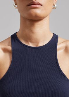 Color: Navy Cotton blend rib knit with stretch Fitted silhouette Racerback Sleeveless tank Unlined 98.5% Cotton 1.5% Elastane Machine Wash Cold By The Frankie Shop. Imported Rib Tank Top, Denim Suit, The Frankie Shop, Frankie Shop, Ny City, Paris Woman, Ribbed Tank Tops, Leather Texture, Fitted Silhouette