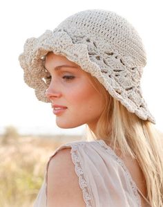 a woman wearing a white crochet hat