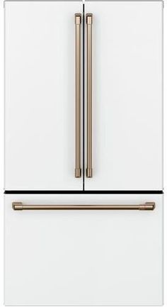 a white refrigerator freezer with two gold handles