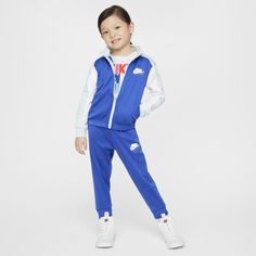 Reimagine active comfort with this tracksuit. The jacket has a full-zip closure for easy layering, the standing collar adds extra coziness and the matching tapered pants have ribbed cuffs and a comfy elasticized waistband. Both pieces are enhanced with quick-drying, moisture-wicking Dri-FIT technology to help littles stay cool and dry while they play. Pair with any Nike tank or tee for a completed look. Winter Sportswear Sweats For Jogging, Winter Gym Tracksuit With Ribbed Cuffs, Sporty Track Jacket With Ribbed Cuffs For Loungewear, Winter Athleisure Tracksuit With Ribbed Cuffs, Winter Sportswear Sweats, Nike Hooded Activewear For Jogging, Fleece Tracksuit With Ribbed Cuffs For Sports, Winter Sports Tracksuit With Ribbed Cuffs, Sportswear Sweats With Ribbed Waistband For Jogging