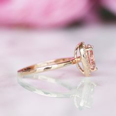 Beautiful Pear Peachy-Pink Morganite Stacking Ring Set ►Base Metal: Sterling Silver (S925) ►Plating: 14K Rose Gold Vermeil ►Accented With Simulated Diamonds ►Please be aware that plated jewelry can wear off over time, if this is a concern we would suggest going with the sterling silver or solid gold jewelry option. Center Stone: Morganite Stone Cut: Teardrop Color: Peachy-Pink Stone size: 8.0 x 6.0 mm Carat Weight: 1.21 ct. Gemstone Creation: Lab-Created ►Sterling silver ring can be purchased at Classic Pink Cluster Ring For Anniversary, Heirloom Oval Rose Gold Birthstone Ring, Classic Pear-shaped Ring For Gift, Classic Oval Rose Gold Birthstone Ring, Elegant Birthstone Halo Ring For Anniversary, Elegant Anniversary Halo Ring With Birthstone, Classic Pink Gold Rings As Gift, 14k Gold Halo Ring With Round Band For Anniversary, Classic Halo Ring With Birthstone