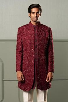 Wine sherwani with all-over intricate embroidery in chevron pattern, concealed placket and full sleeves. Comes with white trousers.
Component: 2
Embroidered
Neckline: Band Collar
Sleeve Length: Full
Fabric: Sherwani: Silk; Trousers: Suiting
Color: Maroon
Note: The kurta worn by the model is not for sale - Aza Fashions Maroon Sherwani, Sherwani For Men Wedding, Embroidered Sherwani, Groom Dress Men, Sherwani For Men, Dress Men, White Trousers, Silk Trousers, Embroidered Neckline