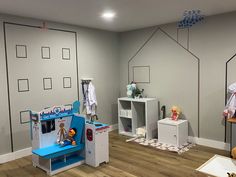 a child's playroom with toys and furniture