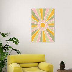 a living room with a yellow chair and potted plant