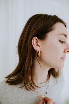 Add a touch of understated elegance with The Mini Dottie Hoops. These delicate hoops are the perfect way to elevate your everyday look with a subtle glimmer. With their tiny, minimalistic design, these hoops provide just the right amount of shine to make a statement while maintaining a light, barely-there charm. The Details - Material: 18K Gold Filled—offering a luxurious gold finish with long-lasting durability and a shine that won’t fade. - Hoop Size: 10mm—small and delicate, providing a refin Everyday 14k Gold Filled Huggie Earrings, Simple Gold Huggie Earrings Tarnish Resistant, Tiny Gold Huggie Earrings Simple Style, Delicate Gold Hoop Earrings For Everyday, Delicate 14k Gold Filled Hoop Earrings For Everyday, Simple Tiny Gold Huggie Earrings, Tiny Gold Minimalist Huggie Earrings, Delicate Yellow Gold Huggie Earrings For Everyday, Everyday Minimalist Rose Gold Huggie Earrings