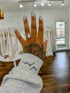 a woman's hand with tattoos on it and the words i love you written on it