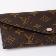 Expertly crafted from Louis Vuitton's signature monogram printed canvas, the Josephine wallet is the ideal accessory to hold all your cards and bills. With its pretty, baby pink interior feature, this wallet is elegant as well as functional. Featuring numerous compartments for bills, receipts, cards, and anything else that ends up in your wallet, the Josephine can carry it all. A classic piece from LV, this wallet will remain in your collection forever. SPL Exterior Louis Vuitton monogram canvas Pink button closure Envelope silhouette Excellent condition Interior Pink canvas top and bottom flap Monogram canvas middle section Four credit card slots One compartment for bills One large compartment or ID card and receipts One flat pocket for notes Excellent condition SPL Height 9.5cm Width 19c Pink Canvas, Pink Interior, Monogram Prints, Dior Shoes, Printed Canvas, Chic Me, Exclusive Bag, Casual Backpack, Chanel Handbags