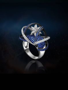 This is a large supernova ring for women.  Women's Supernova Ring, Star and Galaxy Jewelry, Mixed Metal Ring, Star Ring, Galaxy Ring, Statement Ring, Wide Silver Ring, Large Blue Ring It is about rebirth, nirvana, the power to live a new life or self breakthrough. Through artistic imagination, I've got the idea of associating the design with astronomical phenomena about supernova. There is a brilliant new star at the center and a circular-shaped design turning inside out outside the center. The design presents the process of stellar nirvana with huge energy revived. After throwing away the old and decayed body to the universe which will burst into the universe with 5,700 times brighter than sunshine, everything will calmly back to the smallest grain of dust. However, it is not the end of l Luxury Star-shaped Diamond Ring, Luxury Blue Star-shaped Jewelry, Luxury Star-shaped Rings For Formal Occasions, Star And Galaxy, Mixed Metal Ring, Argentium Silver Jewelry, Galaxy Jewelry, Wide Silver Ring, Galaxy Ring