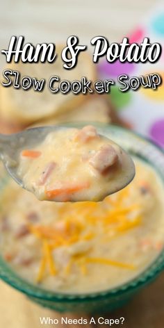 ham and potato slow cooker soup in a glass bowl with a spoon full of cheese