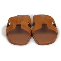 This pair of Oran sandals are in Naturel suede goatskin, with the iconic H cutout detail, Naturel leather goatskin insole, and natural leather soles.Origin: ItalyCondition: New and never worn - a small scratch on the bottom of one of the sandalsAccompanied by: Hermes box, dustbagsSize: 37 EU Tan Hermes Sandals, Hermes Oran Brown, Hermes Sandals Fur, Brown Leather Sole Slip-on Footbed Sandals, Beige Leather Slip-on Footbed Sandals, Hermes Oran Sandals, Hermes Birkin 35, Hermes Box, Rug Bag