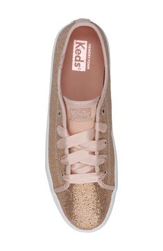 Your kiddo will love heading out in this shimmery sneaker fitted with grosgrain laces and a memory-foam footbed for everyday comfort. Lace-up style Memory foam cushioning Synthetic upper/textile lining/rubber sole Imported Rose Gold Sparkle, Gold Sparkle, Keds, Up Styles, Memory Foam, Rubber Sole, Size 2, Nordstrom, Sparkle