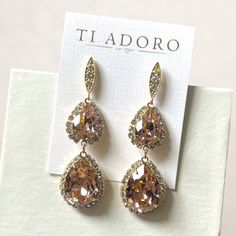 Ti Adoro Brand Addison Earrings Graceful, Classic, And Most Important Of All, Beautiful. The Addison Earrings From Ti Adoro Are Sure To Complement Any Gown You Wear And Make You The Talk Of The Ball. Made With Rose-Colored Stones With Crystals Surrounding Them, The Addison Earrings Are Nothing Short Of Elegant. Dimensions: 2 1/4” Color: Gold Stone: Rose Pink Stone Is Much Pinker In Person And Softer But With Light Reflection Appears More Gold Perfect For Wedding, Black Tie, Elegant Events New Wi Elegant Pink Chandelier Earrings For Formal Occasions, Elegant Pink Chandelier Earrings For Formal Events, Glamorous Pink Bridal Earrings For Wedding, Glamorous Pink Bridal Earrings, Pink Glamorous Wedding Jewelry, Glamorous Pink Wedding Jewelry, Elegant Pink Teardrop Chandelier Earrings, Pink Elegant Jewelry For Wedding, Elegant Pink Jewelry For Wedding