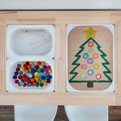 a wooden tray with three compartments filled with food