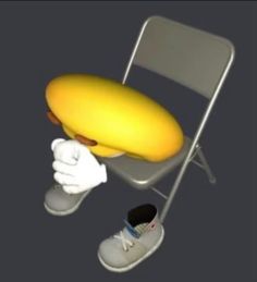 a yellow banana sitting on top of a chair next to a pair of white shoes