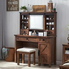 a wooden desk with a mirror and stool