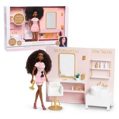 a doll in a pink bathroom set with a mirror, sink, and shower stall