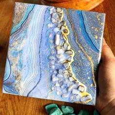 "Geode Mini Art inspired by one of the most serene stones in my collection. I have loved blue lace agate for all its delicate lines and soft beautiful color. This mini Geode painting is a calm shade of blue and has lots of details and textures. A Small Luxury with lots of Sparkle for your space. This painting Is done on a cradled birch board, 6\"x6\" inch with a height of 1.5\" I hope you like it xx lol" Blue Agate Geodes With Natural Stones, Handmade Blue Geodes As Gifts, Blue Agate Geodes, Handmade Blue Geodes As A Gift, Handmade Blue Geodes For Gifts, Handmade Blue Geodes For Gift, Bohemian Agate Geodes As A Gift, Geode Painting, Resin Art Canvas