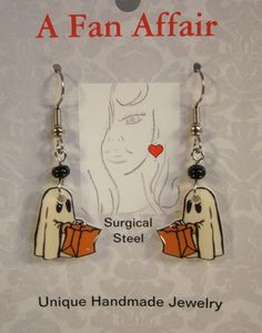 "These adorable light weight earrings feature print art of a ghost trick or treating. Handmade Altered art Made with acrylic, resin and stainless steel connectors and surgical steel ear wire. Highlighted with glass beads. Measure slightly over 1 1/4\" long Pay one low shipping price for all items ordered. US orders ship for $3.50 Visit www.afanaffair.com or the 'Wearable Memories' shop section on Etsy to find out how to put your own photos on jewelry Like us on facebook for money saving coupons Fun Halloween Earrings For Gifts, White Jewelry Gift, Fun Halloween Earrings Gift, Fun Halloween Gift Earrings, Halloween Themed White Earrings, Fun White Halloween Jewelry, Fun White Jewelry For Halloween, Halloween Themed Earrings As Gift, Halloween Themed Earrings For Gifts