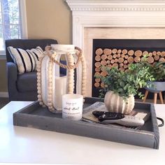 a living room with a couch, coffee table and fireplace