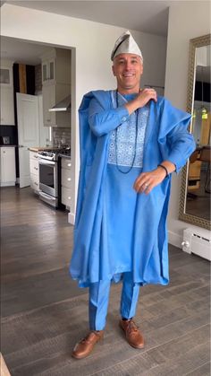 Experience the elegance of Nigerian fashion with our Luxury Sky Blue Agbada for Men, a custom-sized African suit ideal for weddings and special events. This exquisite piece of men's clothing combines traditional design with a modern twist, making it a perfect choice for those seeking a unique and culturally-rich attire. Key Feature: 👔 Tailored Elegance: Custom-sized for a perfect fit, exuding sophistication at every turn. 🎨 Vibrant Authenticity: Crafted with premium materials, boasting intricate African-inspired detailing. 🌟 Statement Piece: Elevate your style with this [luxurious] ensemble, commanding attention effortlessly. 💪 Comfort Redefined: Designed for [maximum comfort], ensuring you feel as good as you look. 🎉 Versatile Appeal: Perfect for weddings, celebrations, or any occasi Elegant Blue Agbada For Traditional Ceremonies, Blue Agbada For Traditional Ceremonies, Elegant Blue Ceremonial Agbada, Luxury Blue Traditional Agbada, Blue Agbada, Agbada Styles Men, Agbada For Men, Traditional Skirts, Couples African Outfits