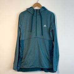 Adidas Climawarm Transition Running Top Pullover. Half Zipper. Teal Green. Thumb Holes. Hooded With Drawstrings. Measurements (Approximate): Shoulders Seam To Seam- 15” Sleeves Seam To Cuff - 27” Length- 24” Front, 26” Back Chest Armpit To Armpit -40” New With Tags. Green Half-zip Activewear For Sports, Functional Adidas Activewear For Outdoor Activities, Adidas Functional Activewear For Outdoor Activities, Athleisure Half-zip Hoodie For Outdoor, Half-zip Hoodie For Outdoor Activities, Adidas Outdoor Moisture-wicking Activewear, Green Sports Activewear Hoodie, Green Half-zip Athleisure Activewear, Hooded Adidas Activewear With Moisture-wicking