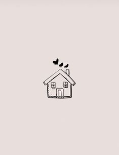 two birds sitting on top of a house