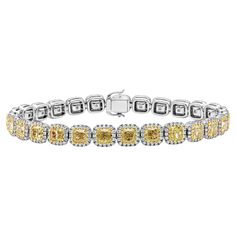 A gorgeous bracelet, featuring 27 cushion cut fancy yellow diamonds weighing 12.92 carats total, each set on a multi-prong setting. Accented by a halo of round cut diamonds weighing 2.04 carats total. Finely made with 18K yellow and white gold. Perfect for casual or formal wear.  Roman Malakov is a custom house, specializing in creating anything you can imagine. If you would like to receive a special quote on a custom piece, please message or call us. Halo Bracelet, Fancy Yellow Diamond, Modern Bracelets, Cushion Cut Diamonds, Gorgeous Bracelet, Cushion Cut, Brilliant Diamond, Yellow Diamond, Yellow Color