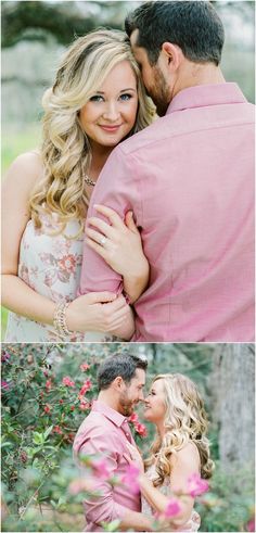 a man and woman hugging each other in front of some trees with pink flowers on them