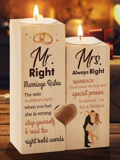 two wooden candles with wedding messages on them