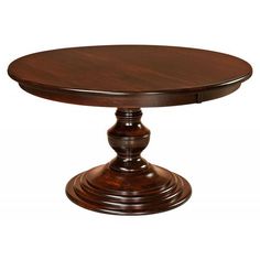 a round wooden table with two pedestals