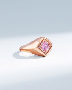 Crafted in 18-karat gold, this signet ring is set with a 4x4mm princess-cut pink sapphire center stone and surrounded by baguette and round white diamonds. Details 18k rose gold 4x4mm princess-cut pink sapphire center, 0.44 carats 0.12 carats of baguette and round white diamonds 10mm width Ref: BAR1055P Luxury Pink Gold Ring With Pink Sapphire, Rose Gold 14k Gemstone Signet Ring, Rose Gold Signet Ring With Gemstone, Rose Gold Gemstone Signet Ring, Luxury Rose Gold Sapphire Ring With Pink Sapphire, Rose Gold Pink Sapphire Rings For Formal Occasions, Luxury Sapphire Rose Gold Ring, Luxury Rose Gold Pink Sapphire Ring, Rose Gold Pink Sapphire Rings - Fine Jewelry