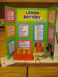 a table with a lemon battery display on it