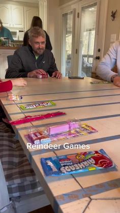 people sitting at a table with candy bars on it