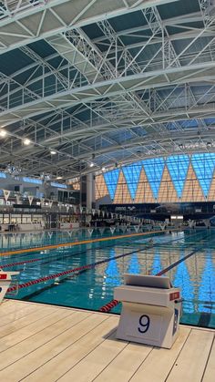 an indoor swimming pool with no people in it