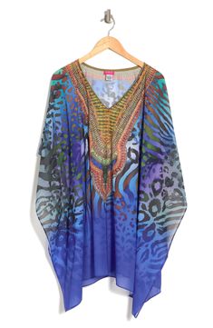 Unleash your free boho spirit in this poncho styled with vivid allover prints. 34'' length (O/S) V-neck Kimono sleeves All-over print Woven 100% polyester Dry clean Imported Model stats: 5'10", 32" bust, 25" waist, 36" hip. Model is wearing size OS. Bohemian Multicolor Print V-neck Kaftan, Multicolor One-size Poncho For Vacation, Multicolor One Size Poncho For Vacation, Multicolor Long Sleeve Poncho For Beach, Multicolor Long Sleeve Poncho For The Beach, One Size Bohemian Blue Cover-up, Blue Bohemian One Size Kaftan, Multicolor Bohemian Printed Cover-up, Bohemian Blue One-size Cover-up