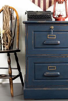 an old fashioned desk and chair are sitting next to each other