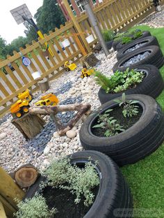 there are many tires that have plants in them